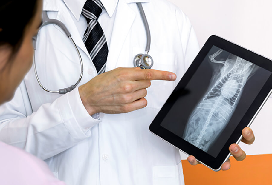 a doctor pointing at a tablet